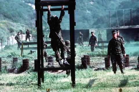 RECORD DATE NOT STATED Navy corpsman runs the obstacle course during a sim... Stock Photos