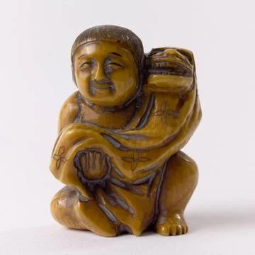 RECORD DATE NOT STATED  Netsuke. Child and lion mask. Japan. Ivory. Paris,... Stock Photos