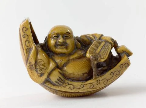 RECORD DATE NOT STATED  Netsuke. Hostei by boat. Japan. Ivory. Paris, Cern... Stock Photos