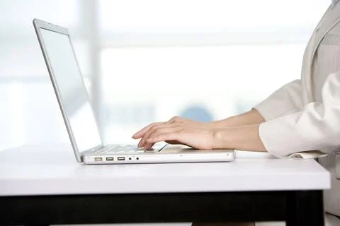 RECORD DATE NOT STATED Office worker using her computer Beijing China Copy... Foto stock
