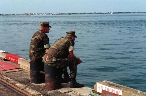 RECORD DATE NOT STATED A pair of Marines look into the harbor while waitin... Stock Photos