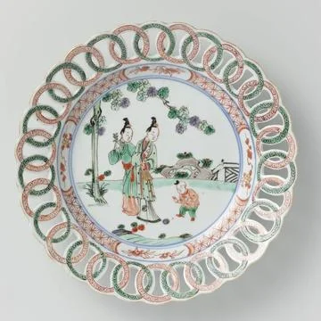 RECORD DATE NOT STATED  Plate with two women and a boy in a garden, rim co... Stock Photos