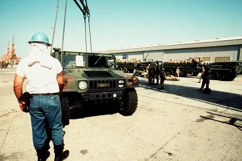 RECORD DATE NOT STATED A sailor holds on to a pair of lifting cables as he... Foto stock