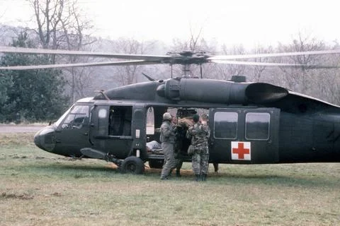 RECORD DATE NOT STATED A simulated casualty is loaded into a UH-60A Black ... Stock Photos