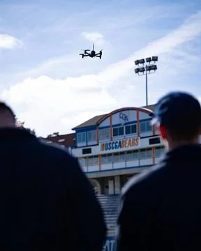 RECORD DATE NOT STATED  Students look up at a drone in flight during a tra... Stock Photos