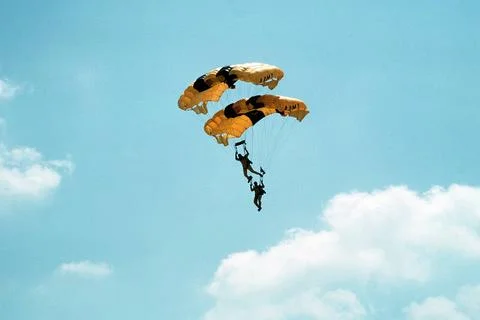 RECORD DATE NOT STATED With their parachute canopies stacked, two members ... Stock Photos