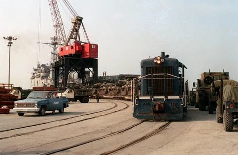 RECORD DATE NOT STATED A train carrying M-60A1 main battle tanks moves pas... Stock Photos