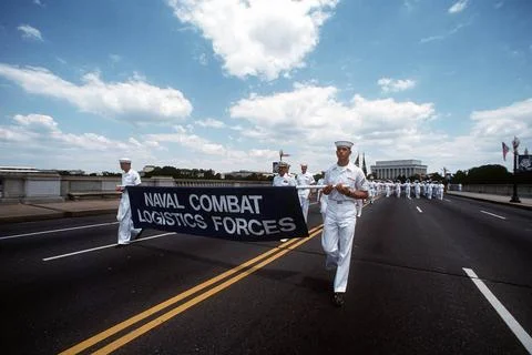 RECORD DATE NOT STATED Two sailors carry a banner at the front of a format... Foto stock