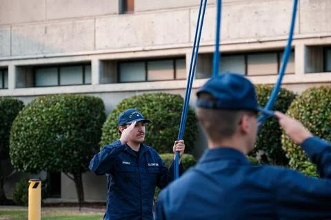 RECORD DATE NOT STATED U.S. Coast Guard members render a salut to the Nati... Stock Photos