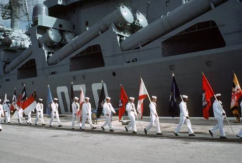 RECORD DATE NOT STATED U.S. sailors carrying state flags parade past the S... Stock Photos