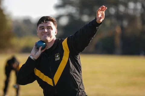 RECORD DATE NOT STATED  U.S. Army Spc. Matthews, Colin throws a shot put d... Stock Photos