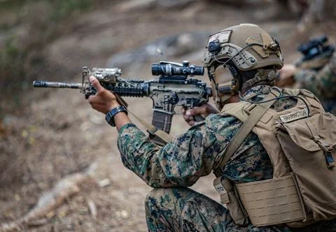 RECORD DATE NOT STATED  A U.S. Marine fires his M4 assault rifle on an Ind... Stock Photos