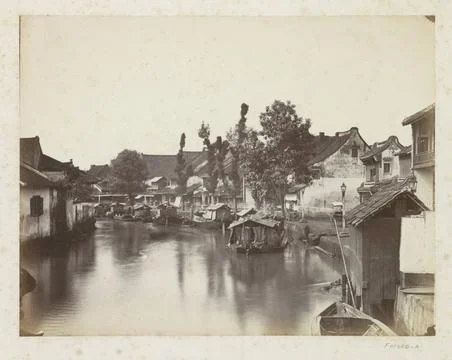 RECORD DATE NOT STATED  View of a river quay with houses and boats on Java... Fotos de archivo