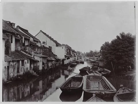 RECORD DATE NOT STATED  View along a water on Java with houses on either s... Stock Photos