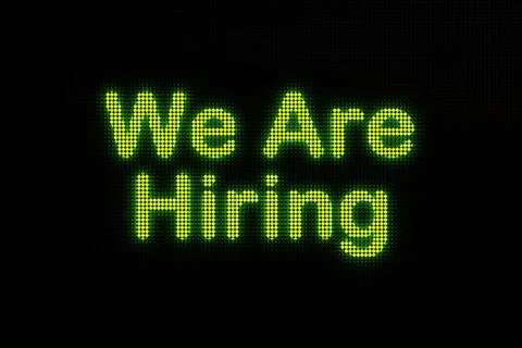 RECORD DATE NOT STATED We are hiring, displayed on a screen. Dark LED scre... Stock Photos