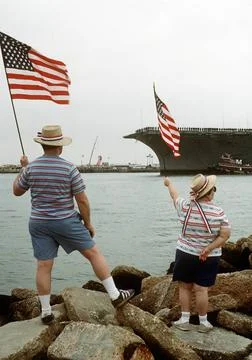 RECORD DATE NOT STATED Well-wishers on the opposite shore wave flags as th... Stock Photos