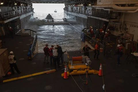 RECORD DATE NOT STATED  Winch team operators help guide a test version of ... Stock Photos