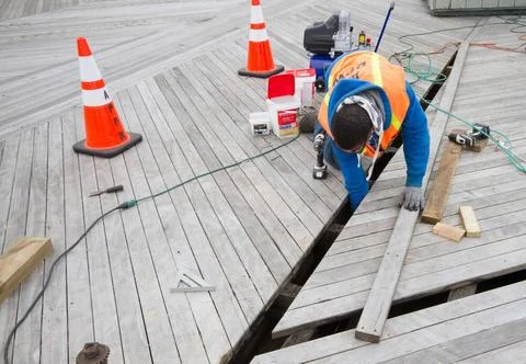 RECORD DATE NOT STATED Worker Repairs Boardwalk Substructure. New Jersey H... Stock Photos