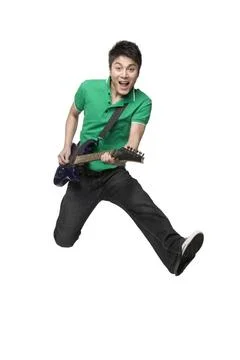 RECORD DATE NOT STATED Young Chinese man playing an electric guitar Beijin... Foto stock