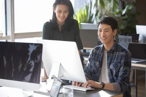 RECORD DATE NOT STATED Young college students using computer Beijing China... Stock-Fotos