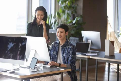 RECORD DATE NOT STATED Young college students using computer Beijing China... 스톡 사진