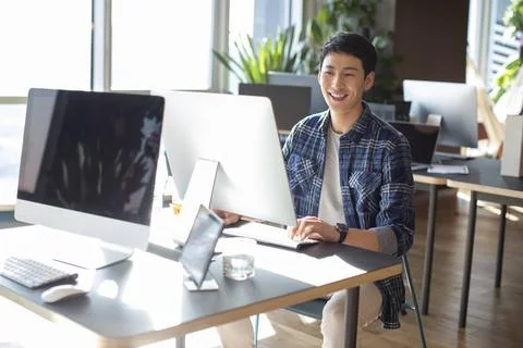 RECORD DATE NOT STATED Young college student using computer Beijing China ... Foto stock
