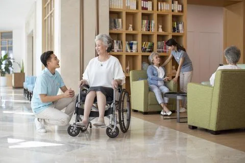 RECORD DATE NOT STATED Young Chinese nurse assistant taking care of senior... 스톡 사진