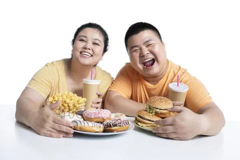 RECORD DATE NOT STATED Young Chinese couple eating fast food Beijing China... Fotos Stock