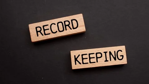 Record keeping message writing on wooden blocks on black background Video stock 284439683