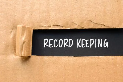 Record keeping message written on ripped torn cardboard paper with black back Stock Photos