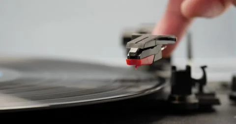 Record player arm being moved onto music record super close Stock Footage 150251032