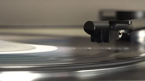 Record player needle setting down on album Stock Footage 125946419