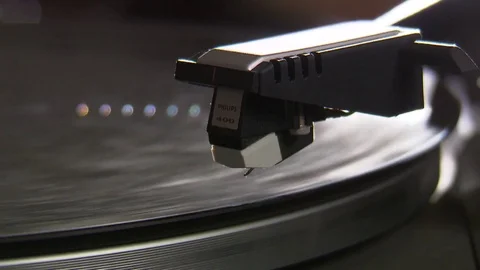 Record player playing Pick up head is put on LP Stock Footage 71824599