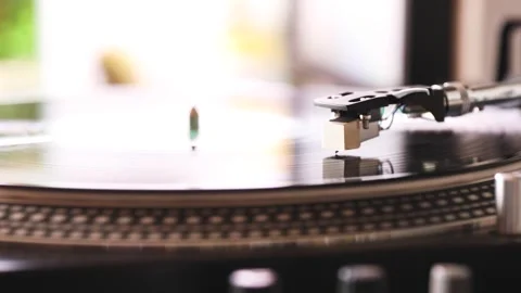 Record player playing vynil record on blurred background Stock Footage 240985774
