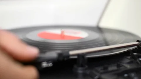 A record player turntable with it's stylus running along a vinyl record Stock Footage