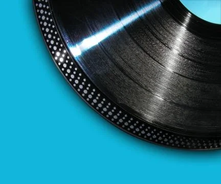 Record playing on blue background Photos