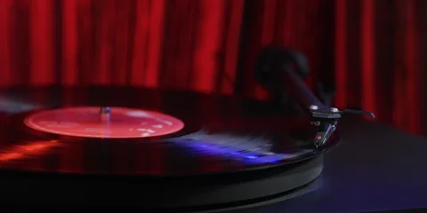 Record Playing with a Red Background Stock Footage 113472801