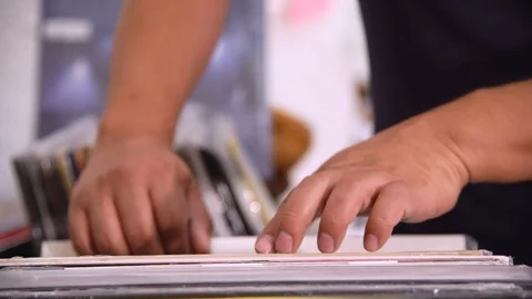 Record store - browsing vinyls Stock Footage 107748822