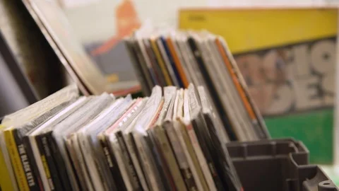 Record store - browsing vinyls Stock Footage 107749227