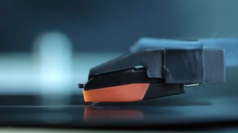 Record turntable disc with it's stylus running along a vinyl record. Macro shot. Stock Footage 46052651