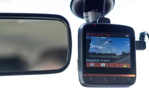 Recording car camera on the front window Stock Photos