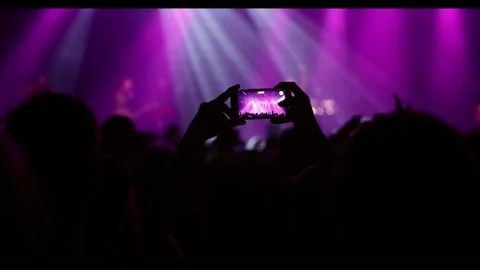 Recording a concert using a mobile phone. Smartphone at music show Stock Footage 273746271