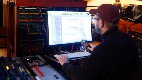 Recording Engineer working in recording studio Stock Footage 257853985