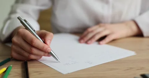 Recording math exercises student solves problem closeup Stock Footage 276443794