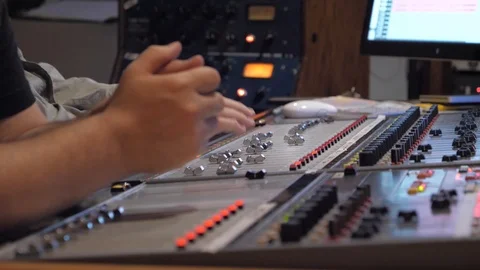 Recording music studio engineer mixing board sound desk in recording studio Stock Footage 95514042