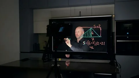 Recording an online course with the help of a teleprompter and a large glass Stock Footage 221504334