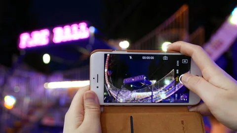 Recording people playing fire ball on iphone Stock Footage 125499441