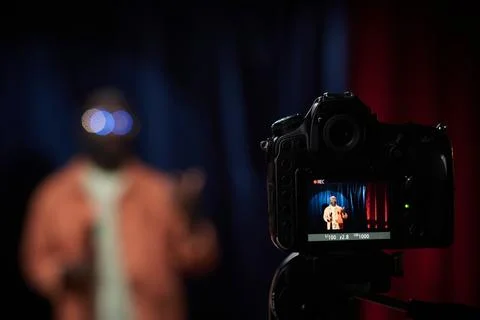 Recording Person Under Soft Light with Camera Equipment Stock Photos