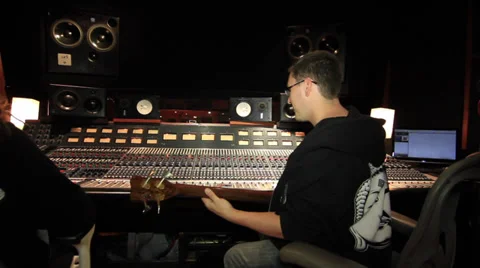 Recording Studio Bass player talking to musicians 15 2 Stockbeeldmateriaal 36178879