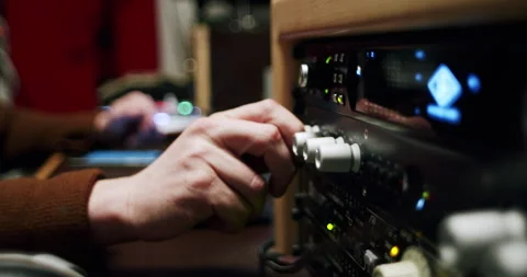 Recording Studio Engineer Adjusts Dials 4K 24FPS Stock Footage 253446082
